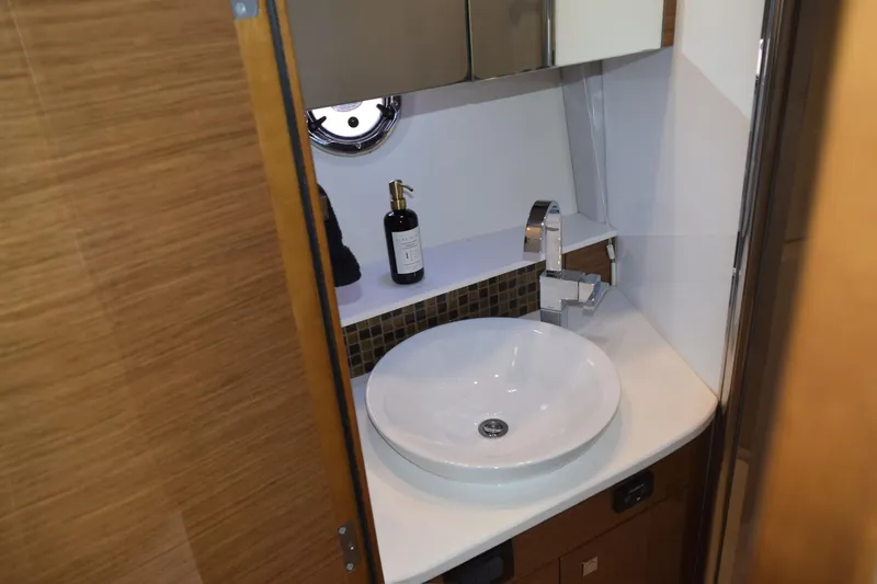 Slide: The Image of Luxurious bathroom in 2018 Cruisers Yachts 45 Cantius with modern sink and fixtures. - 18