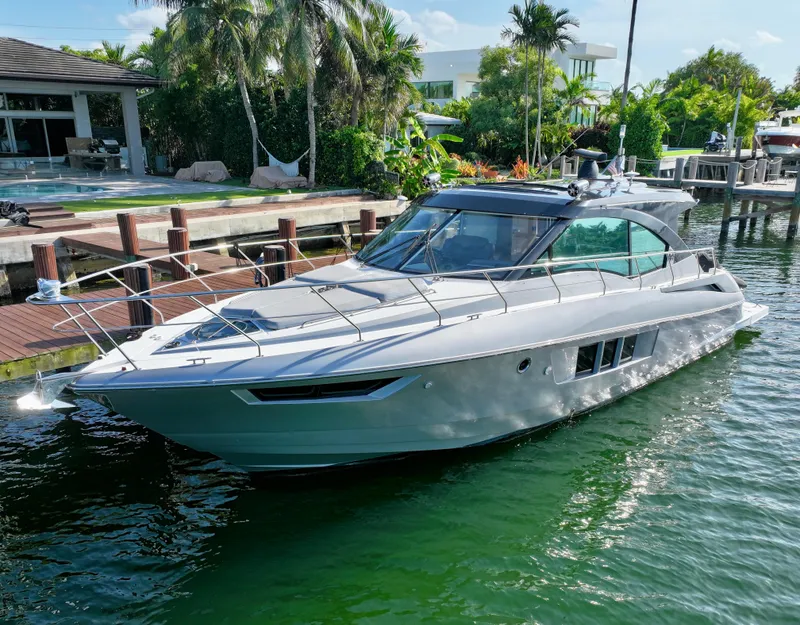 Slide: The Image of 2018 Cruisers Yachts 45 Cantius docked near tropical waterfront home. - 28