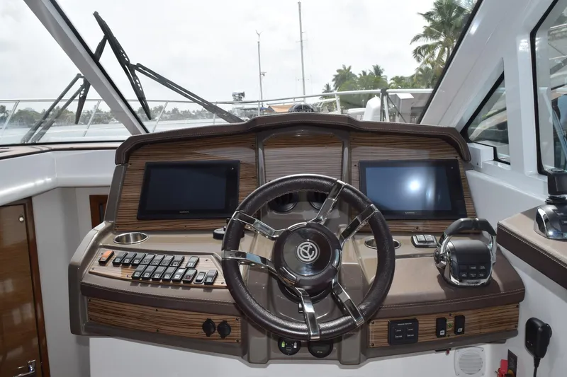Slide: The Image of 2018 Cruisers Yachts 45 Cantius helm with dual screens and modern controls. - 4