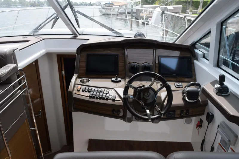 Slide: The Image of 2018 Cruisers Yachts 45 Cantius helm with dual screens and modern controls. - 5