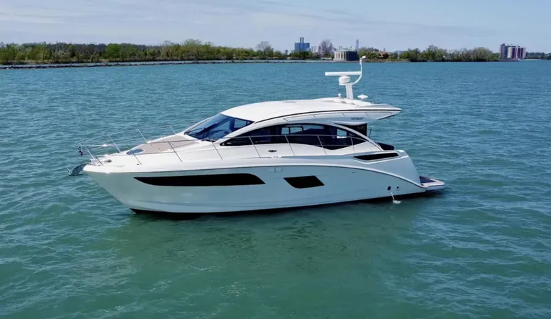 Slide: The Image of 2018 Sea Ray Sundancer 400 yacht cruising on a calm blue lake. - 1