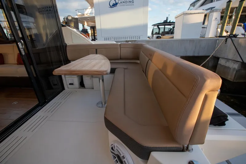 Slide: The Image of 2018 Sea Ray Sundancer 400 yacht with outdoor seating and table. - 22
