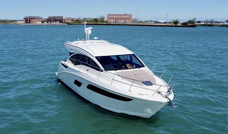 Slide: The Image of 2018 Sea Ray Sundancer 400 yacht cruising on a calm lake. - 3