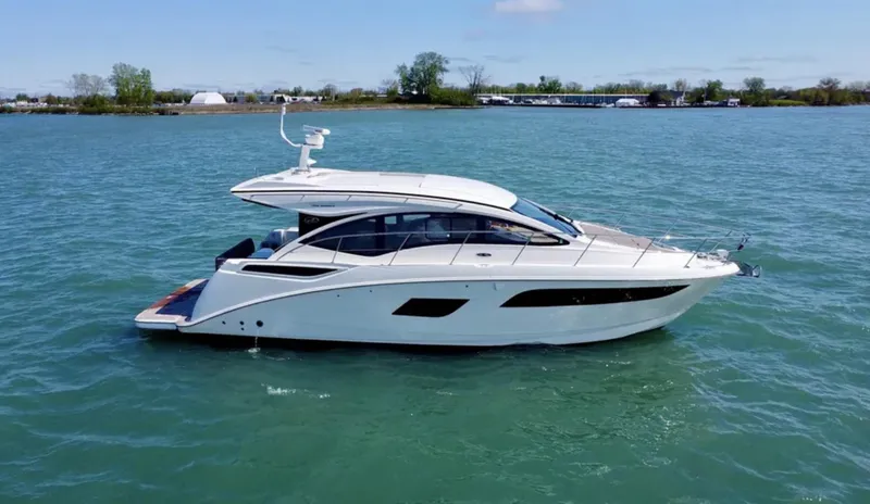 Slide: The Image of 2018 Sea Ray Sundancer 400 boat door with control panel and safety notices. - 4