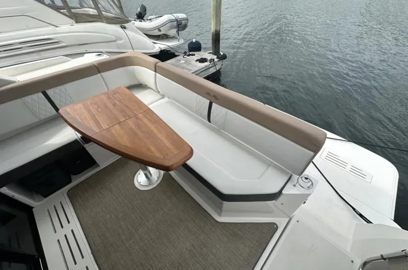 Slide: The Image of Interior of 2018 Sea Ray Sundancer 400 yacht with modern seating and kitchenette. - 5
