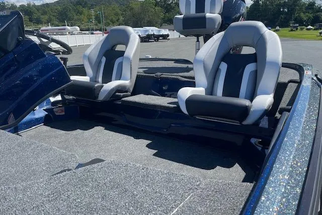 Slide: The Image of 2026 Nitro Z18 Pro boat interior with dual seats and carpeted flooring. - 100
