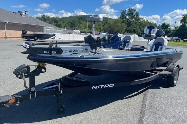Slide: The Image of Nitro Z18 Pro 2026 fishing boat on trailer, parked outdoors under blue sky. - 101