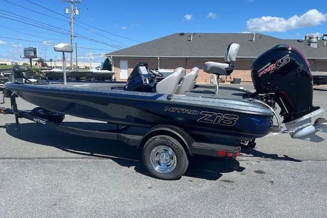 Slide: The Image of 2026 Nitro Z18 Pro fishing boat with powerful outboard motor, parked outdoors. - 96