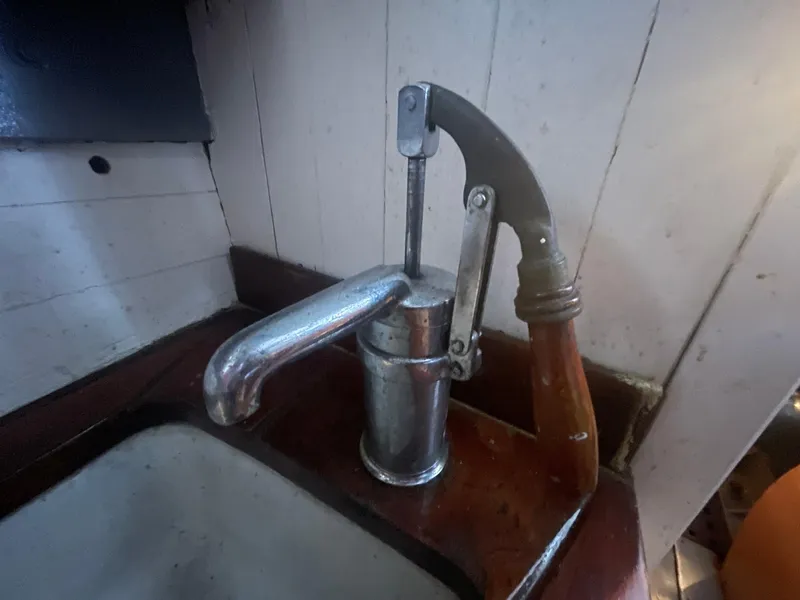 Slide: The Image of Vintage hand pump faucet on Blanchard Dunlin 42, 1920 model, wooden and metal design. - 11