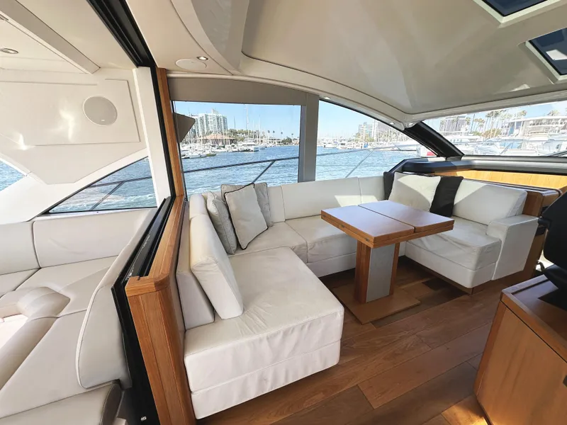 Slide: The Image of Luxurious interior of 2019 Sunseeker Predator 57 yacht with elegant seating and wooden accents. - 18