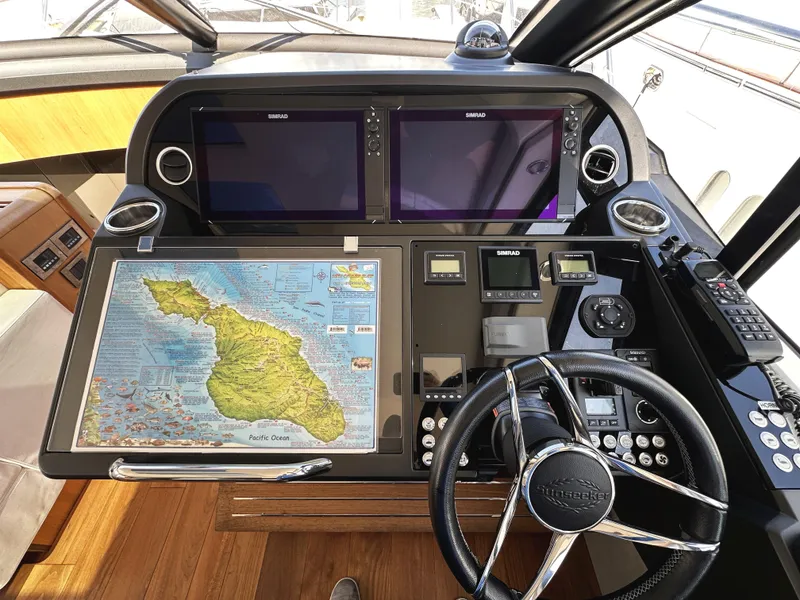 Slide: The Image of Control panel of a 2019 Sunseeker Predator 57 yacht with navigation equipment and map. - 27