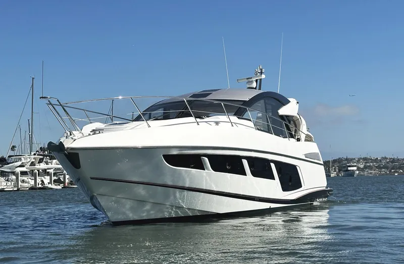 Slide: The Image of 2019 Sunseeker Predator 57 yacht on water, showcasing sleek design and luxury features. - 3