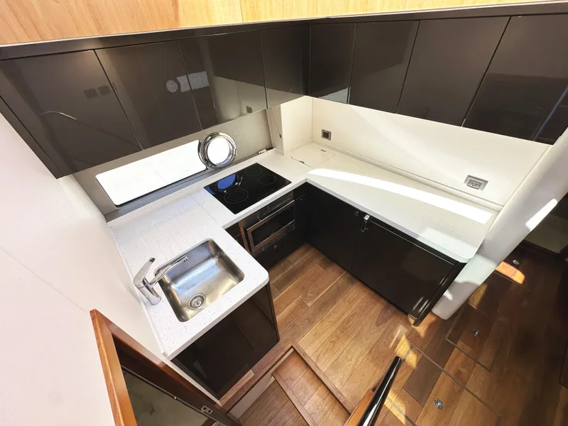 Slide: The Image of Modern kitchen interior of 2019 Sunseeker Predator 57 yacht with sleek cabinetry and appliances. - 33