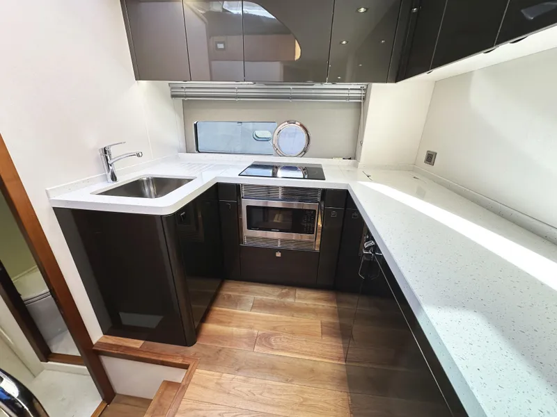 Slide: The Image of Modern kitchen in 2019 Sunseeker Predator 57 yacht with sleek countertops and appliances. - 36