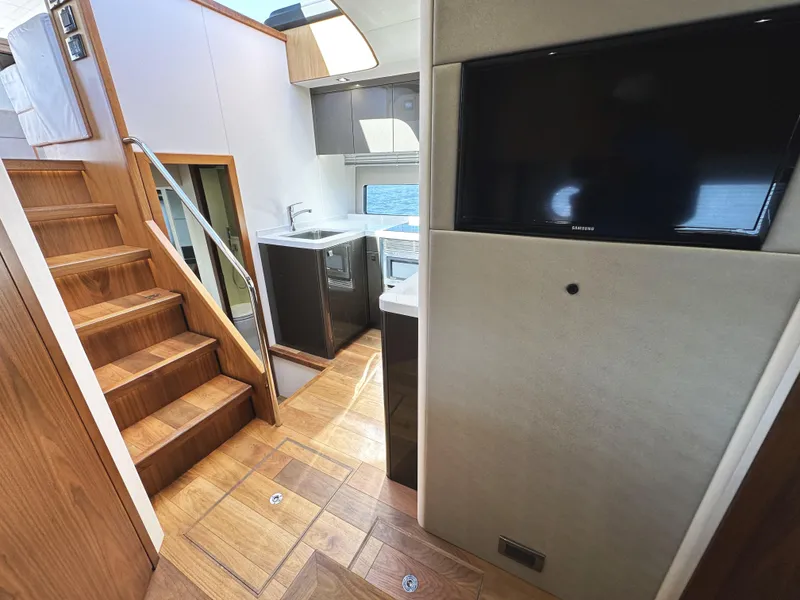 Slide: The Image of Luxurious interior of 2019 Sunseeker Predator 57 yacht with wooden stairs and modern kitchen. - 42