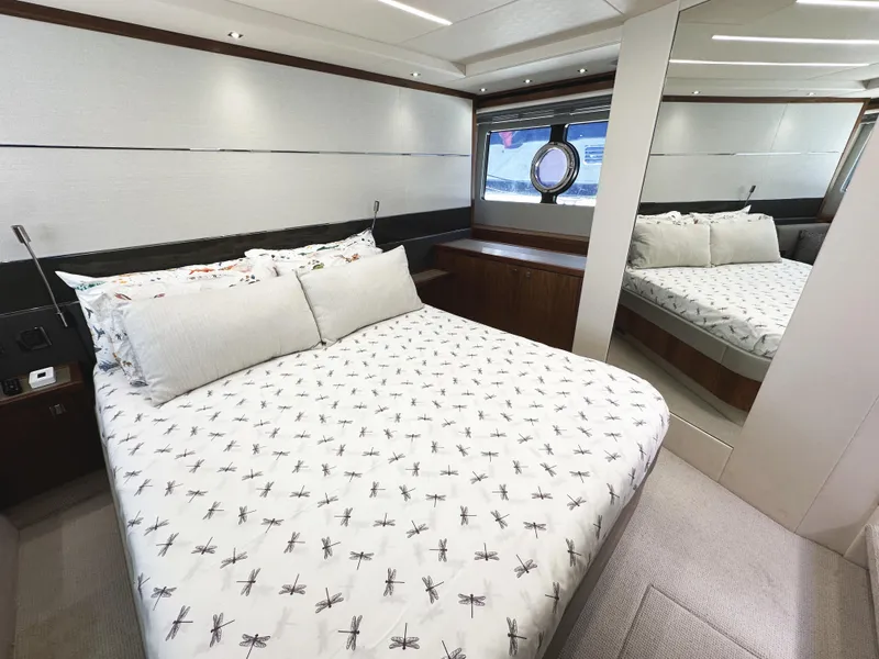 Slide: The Image of Luxurious bedroom interior of 2019 Sunseeker Predator 57 yacht with elegant bedding and mirror. - 44