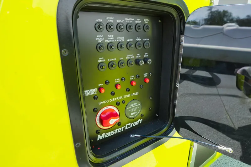 Slide: The Image of Control panel of a 2018 MasterCraft X23 boat, featuring various switches and indicators. - 13