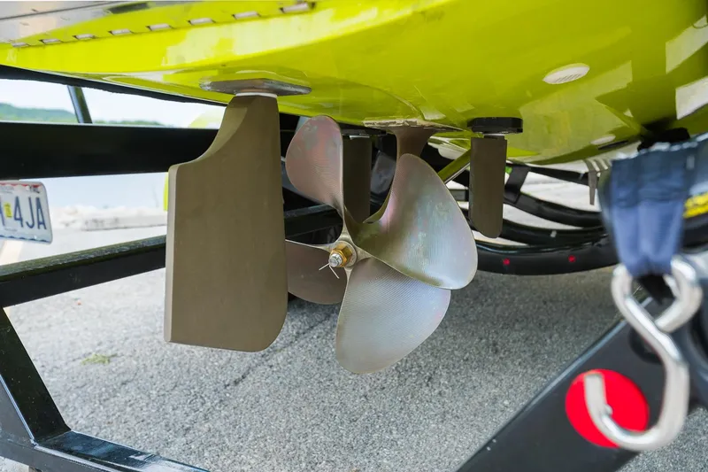 Slide: The Image of 2018 MasterCraft X23 boat propeller and rudder on trailer, close-up view. - 20