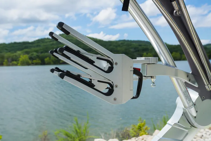 Slide: The Image of 2018 MasterCraft X23 boat with wakeboard rack on a scenic lake. - 30