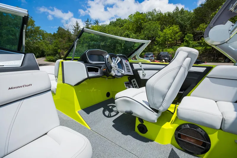 Slide: The Image of 2018 MasterCraft X23 boat interior with modern dashboard and comfortable seating. - 37