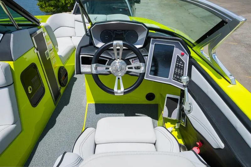 Slide: The Image of 2018 MasterCraft X23 boat cockpit with modern steering and control panel. - 40