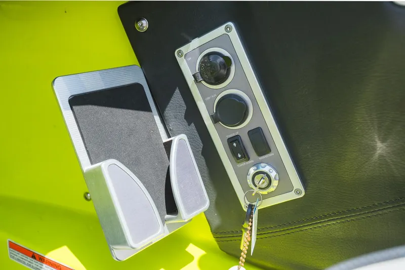 Slide: The Image of Control panel of a 2018 MasterCraft X23 boat with key ignition and USB port. - 43