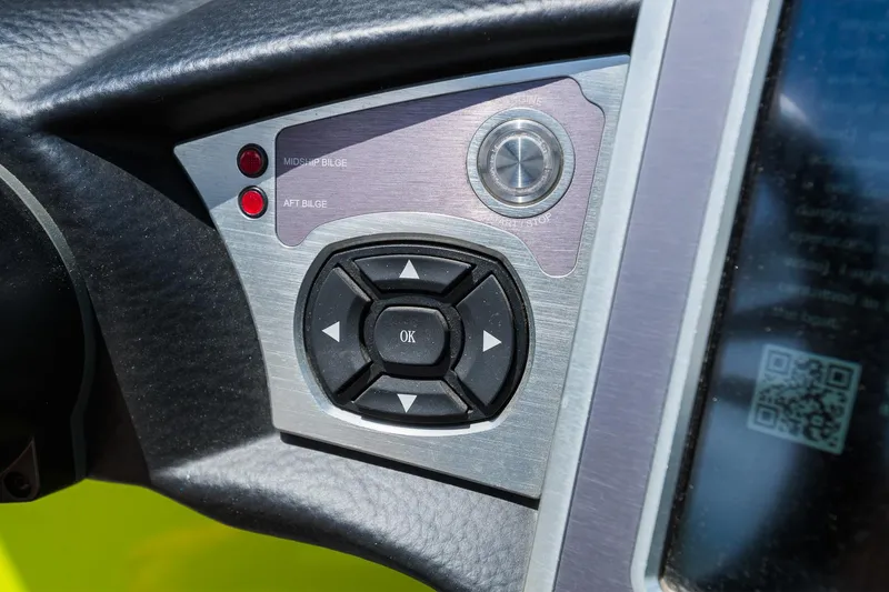 Slide: The Image of Control panel of a 2018 MasterCraft X23 boat with navigation buttons and indicators. - 45