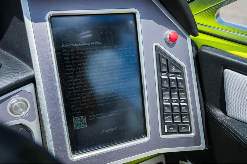 Slide: The Image of Control panel of a 2018 MasterCraft X23 boat with touchscreen and keypad. - 46