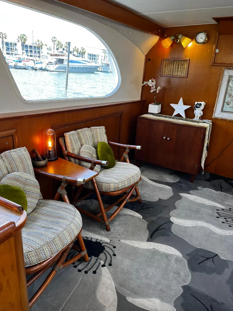 Slide: The Image of Interior of 1965 Hatteras 41 Twin Cabin with cozy seating and nautical decor. - 26