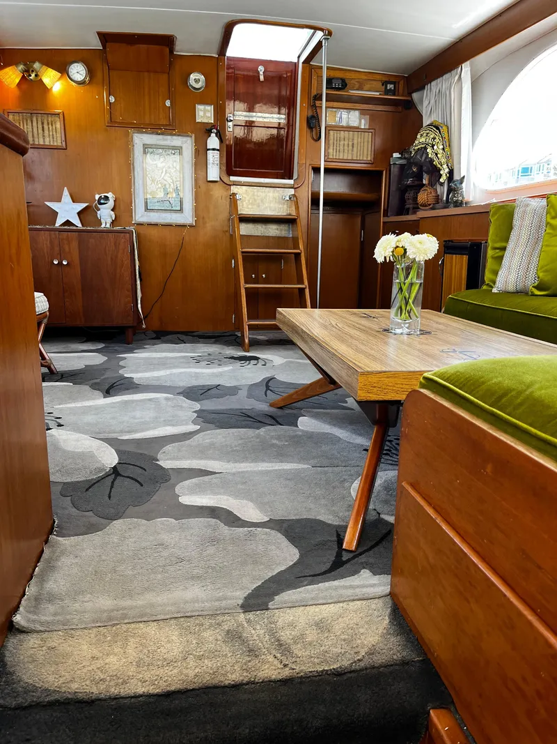Slide: The Image of Interior of a 1965 Hatteras 41 Twin Cabin with vintage decor and floral carpet. - 27