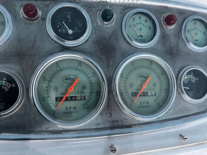 Slide: The Image of Vintage 1965 Hatteras 41 Twin Cabin dashboard with RPM and oil pressure gauges. - 43