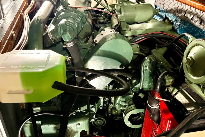 Slide: The Image of Engine compartment of a 1965 Hatteras 41 Twin Cabin boat, showcasing mechanical components. - 45