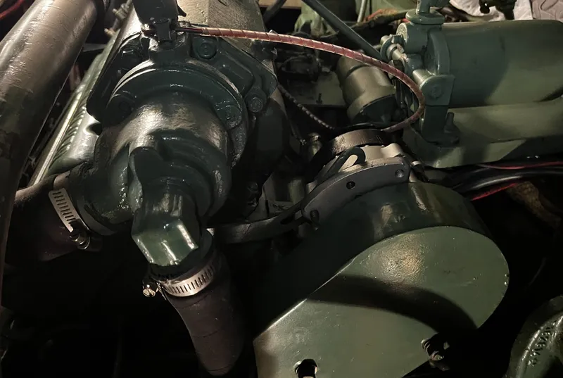 Slide: The Image of Engine components of a 1965 Hatteras 41 Twin Cabin boat, showcasing mechanical details. - 46