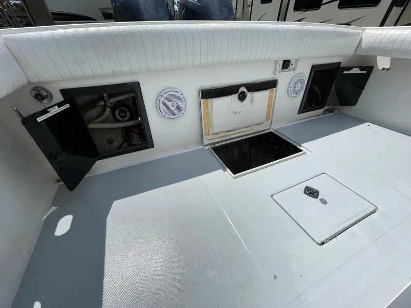 Slide: The Image of 1998 Regulator 26 Classic boat deck with storage compartments and speakers. - 10