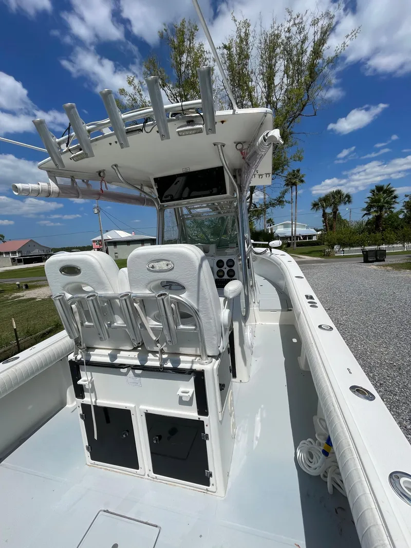 Slide: The Image of 1998 Regulator 26 Classic boat with dual seats and center console. - 11