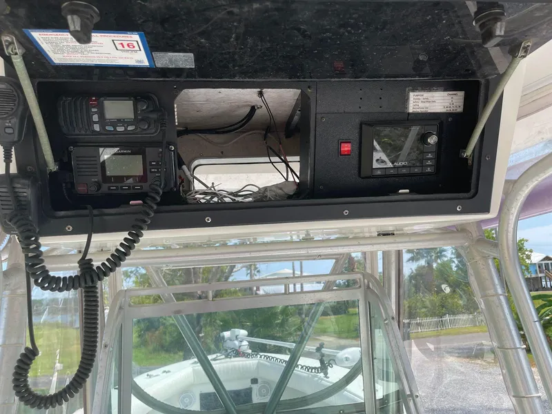 Slide: The Image of 1998 Regulator 26 Classic boat dashboard with radio and navigation equipment. - 17