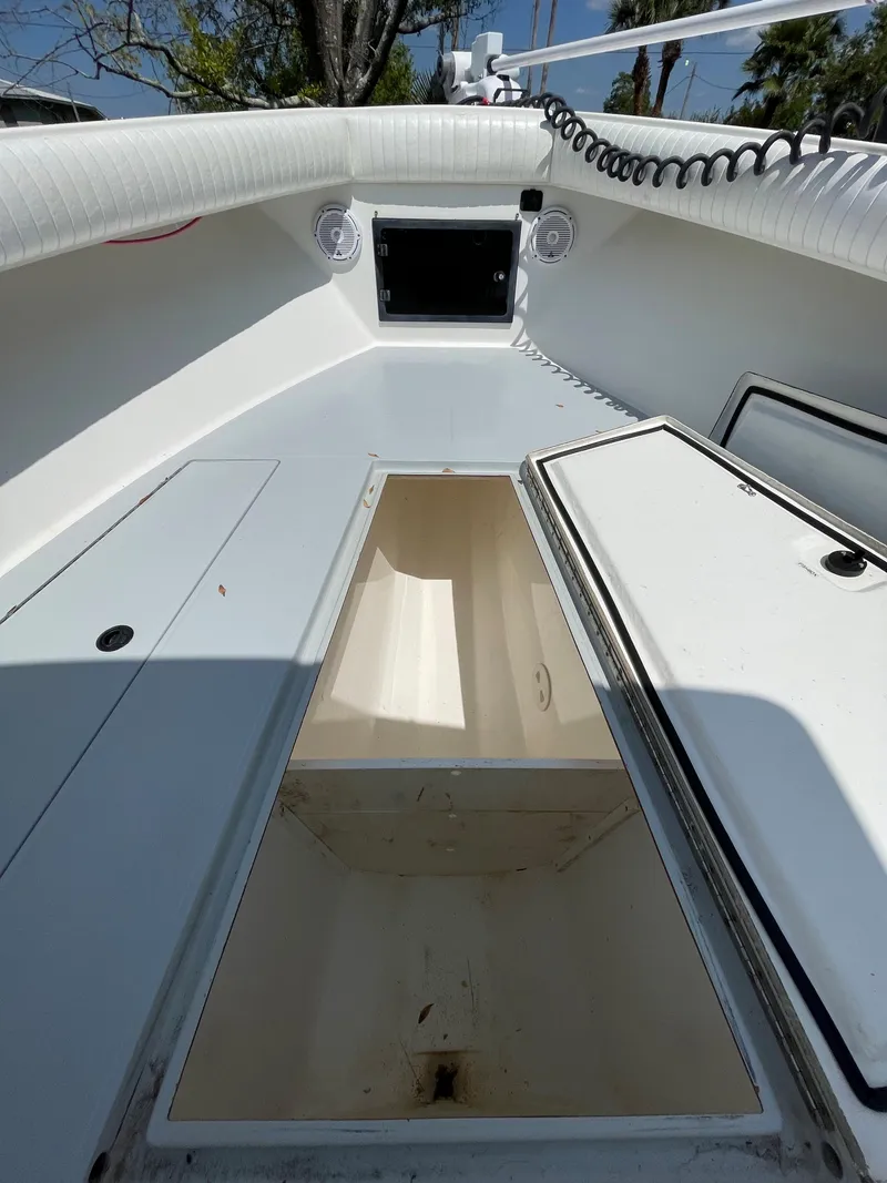 Slide: The Image of 1998 Regulator 26 Classic boat interior with open storage compartments. - 23