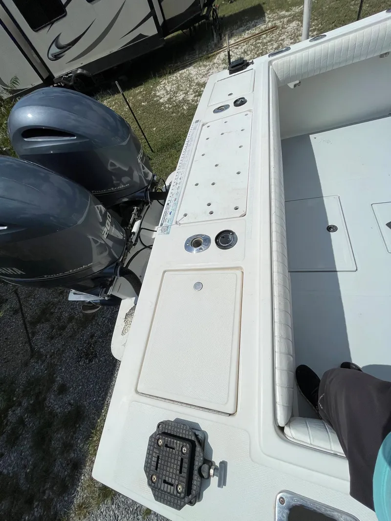 Slide: The Image of 1998 Regulator 26 Classic boat with dual outboard motors and fishing deck. - 9