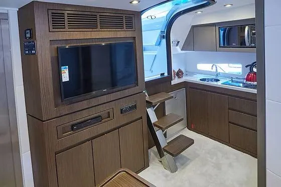 Slide: The Image of Luxurious interior of 2026 Schaefer 400 yacht with modern kitchen and entertainment area. - 10