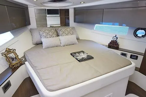 Slide: The Image of Luxurious cabin interior of 2026 Schaefer 400 yacht with elegant bedding and decor. - 13