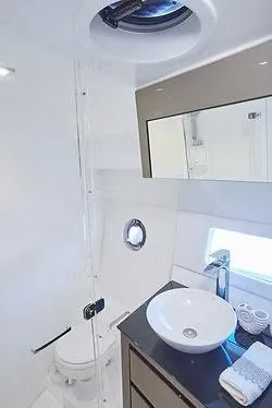 Slide: The Image of Modern bathroom in 2026 Schaefer 400 yacht with sleek fixtures and round sink. - 15
