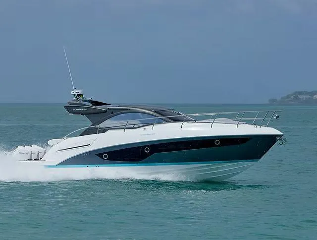 Slide: The Image of 2026 Schaefer 400 yacht cruising on open water, sleek design, modern features. - 3