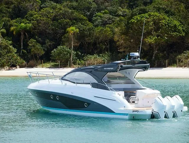 Slide: The Image of Luxury Schaefer 400 yacht, 2026 model, anchored near a tropical beach. - 4
