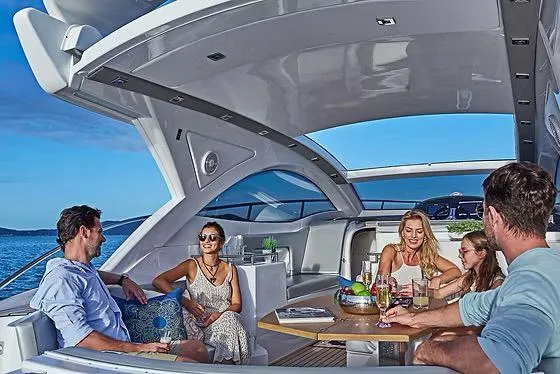 Slide: The Image of People enjoying a gathering on a 2026 Schaefer 400 yacht, with ocean views. - 6