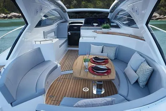 Slide: The Image of Luxurious 2026 Schaefer 400 yacht interior with elegant seating and dining area. - 7