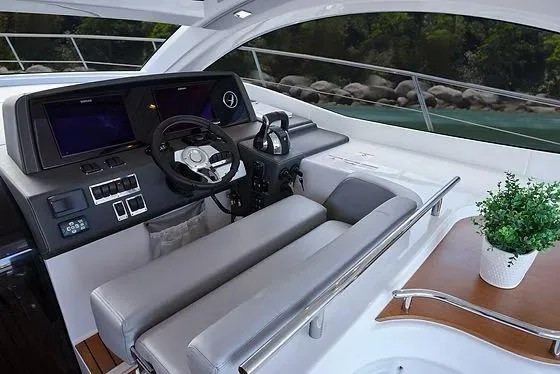 Slide: The Image of Luxurious Schaefer 400 yacht cockpit with modern controls and plush seating, 2026 model. - 9