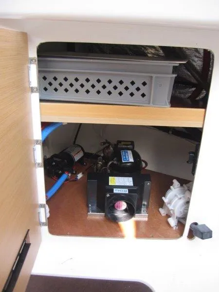 Slide: The Image of 2018 Jeanneau Sun Fast 3600 interior storage compartment with equipment and wiring. - 13