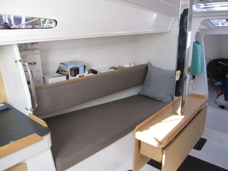 Slide: The Image of 2018 Jeanneau Sun Fast 3600 interior with gray seating and wooden accents. - 20