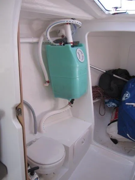 Slide: The Image of 2018 Jeanneau Sun Fast 3600 interior with compact marine toilet and storage. - 22