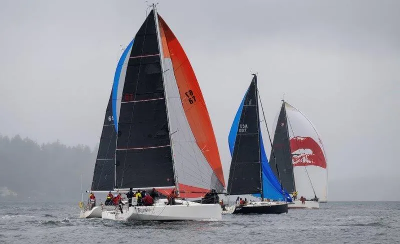 Slide: The Image of Sailboats racing on a cloudy day, featuring a 2018 Jeanneau Sun Fast 3600. - 31